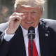 President Donald Trump demonstrates for the cameras how little thought he gave to withdrawing the United States from the Paris Climate Agreement (Photo by Win McNamee/Getty Images)